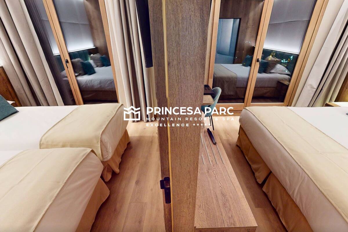 HabitaciĂłn Familiar Premium | Seprai premium, selimut bulu angsa, minibar, dan brankas