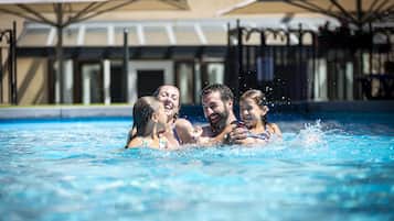 Seasonal outdoor pool, open 10:30 AM to 6:00 PM, pool umbrellas