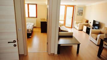 Suite, 1 Double Bed, Balcony | Living area | LCD TV