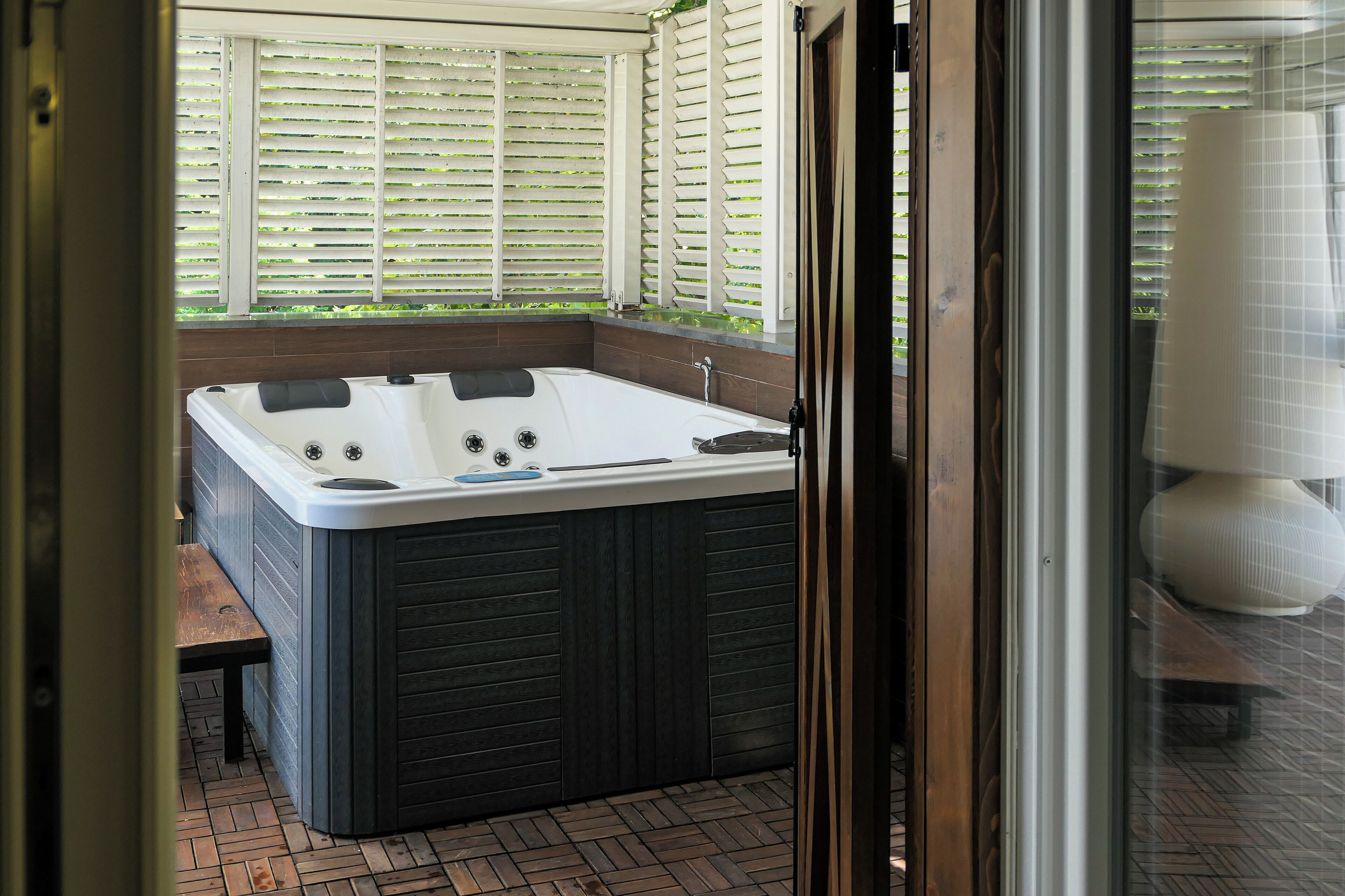 exclusive suite, jetted tub | terrace/patio