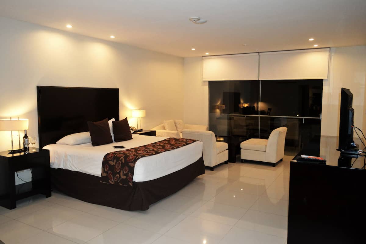 premium double room, 1 king bed, pool view | 1 bedroom, minibar, in-room safe, desk