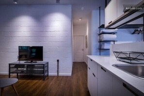 40-inch flat-screen TV with cable channels, TV, Netflix