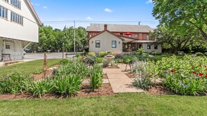 A residential house with a garden in front, a driveway, and a street in the background. - After Eight Bed and Breakfast (Gordonville)