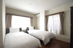 Habitación con 2 camas individuales (Type A) | Wifi gratis y ropa de cama