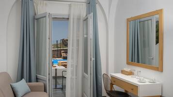 Superior Double Room, Pool Access | Living area | 32-inch Smart TV with digital channels