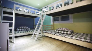 A room with bunk beds, a ladder, and a window. - Bluefish Guesthouse - Hostel (Busan)