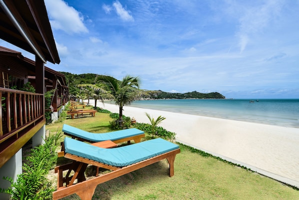 On the beach, sun loungers, beach umbrellas, beach towels