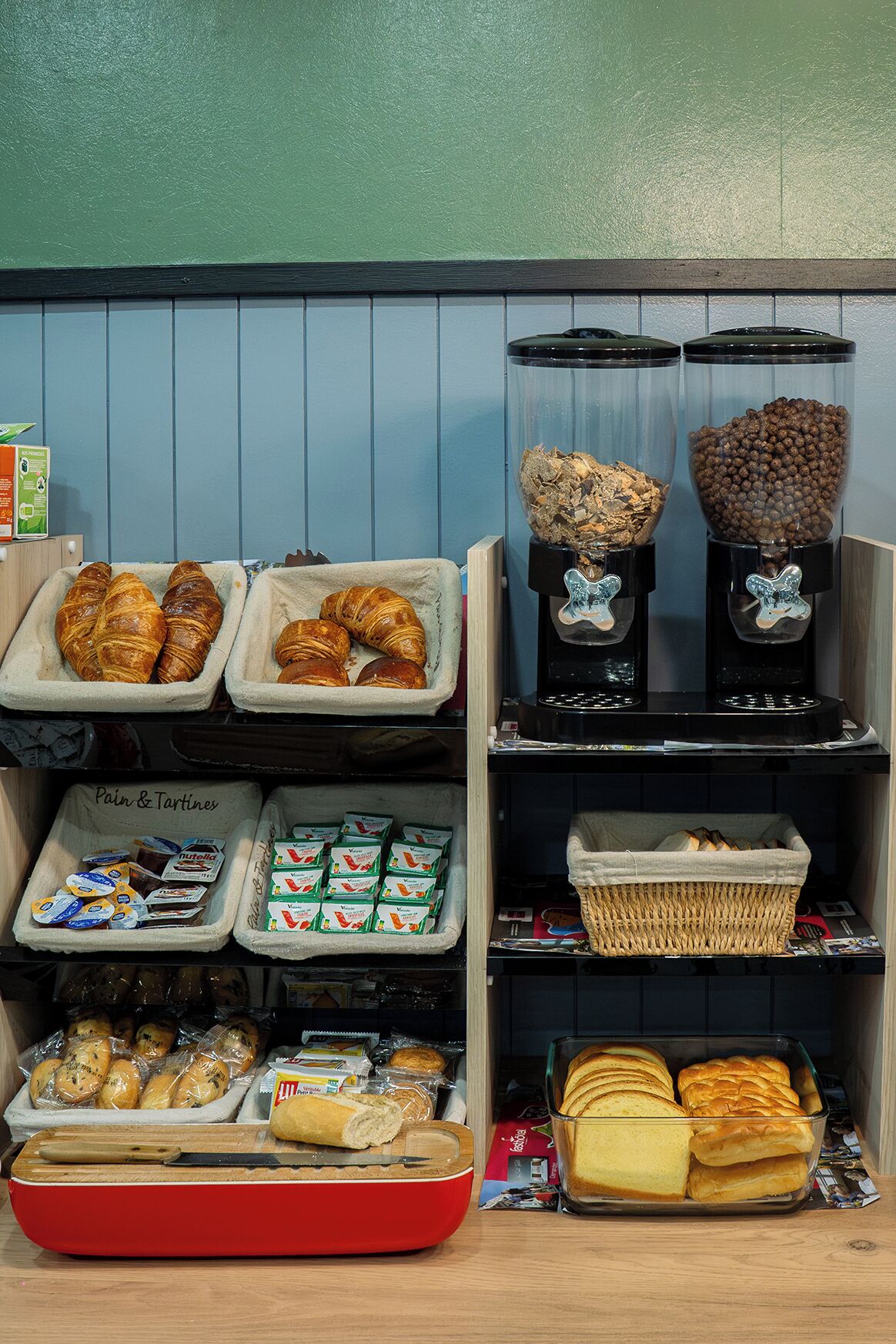 A bakery display with pastries, coffee beans, and packaged goods.