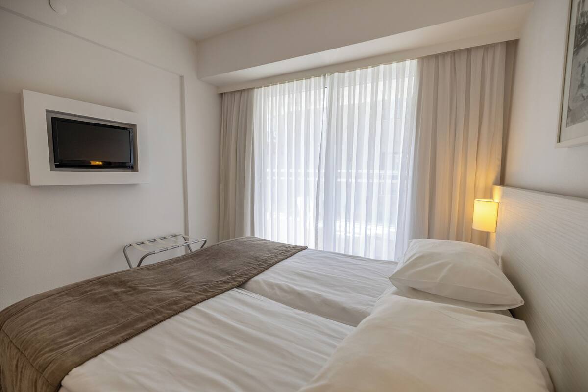 Economy Room,Low Floor Smaller Bathroom Side | Minibar, in-room safe, iron/ironing board (on request), WiFi (free)