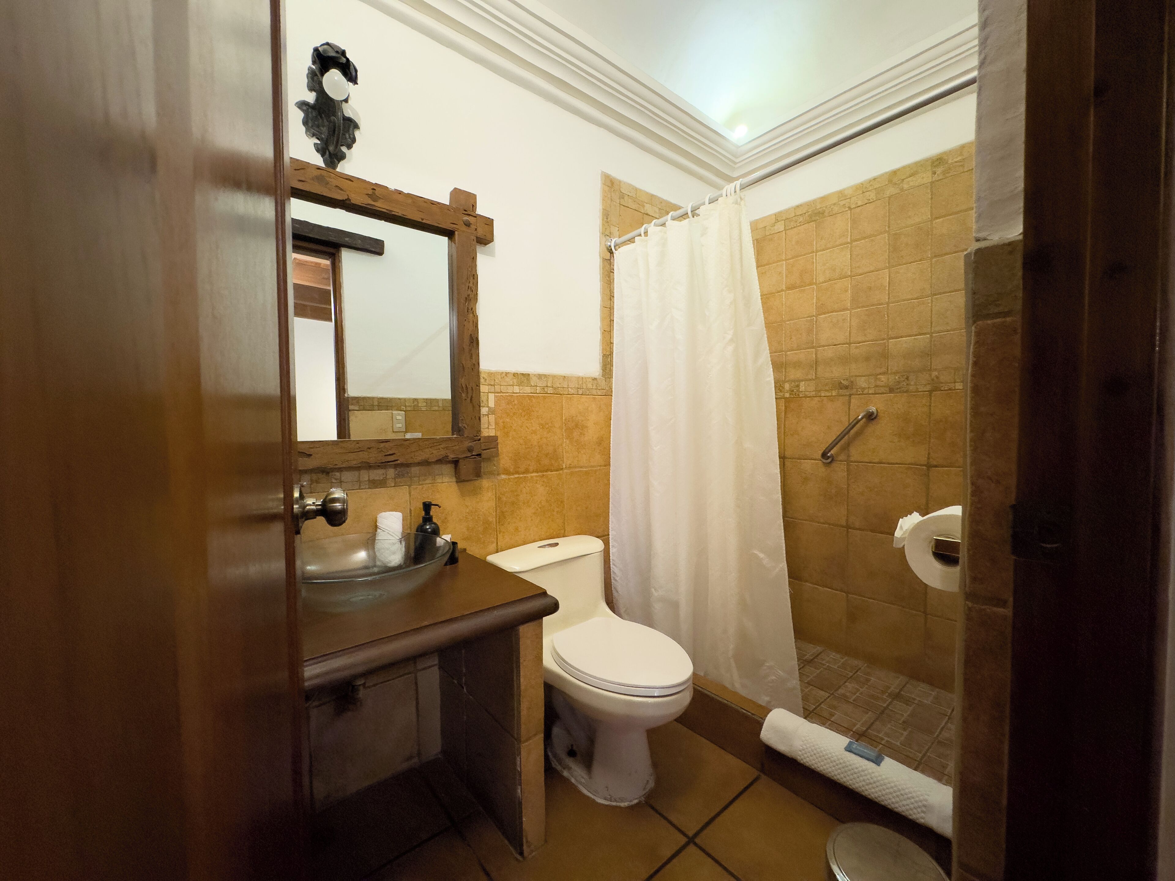 standard double room | bathroom | shower, towels, soap, shampoo