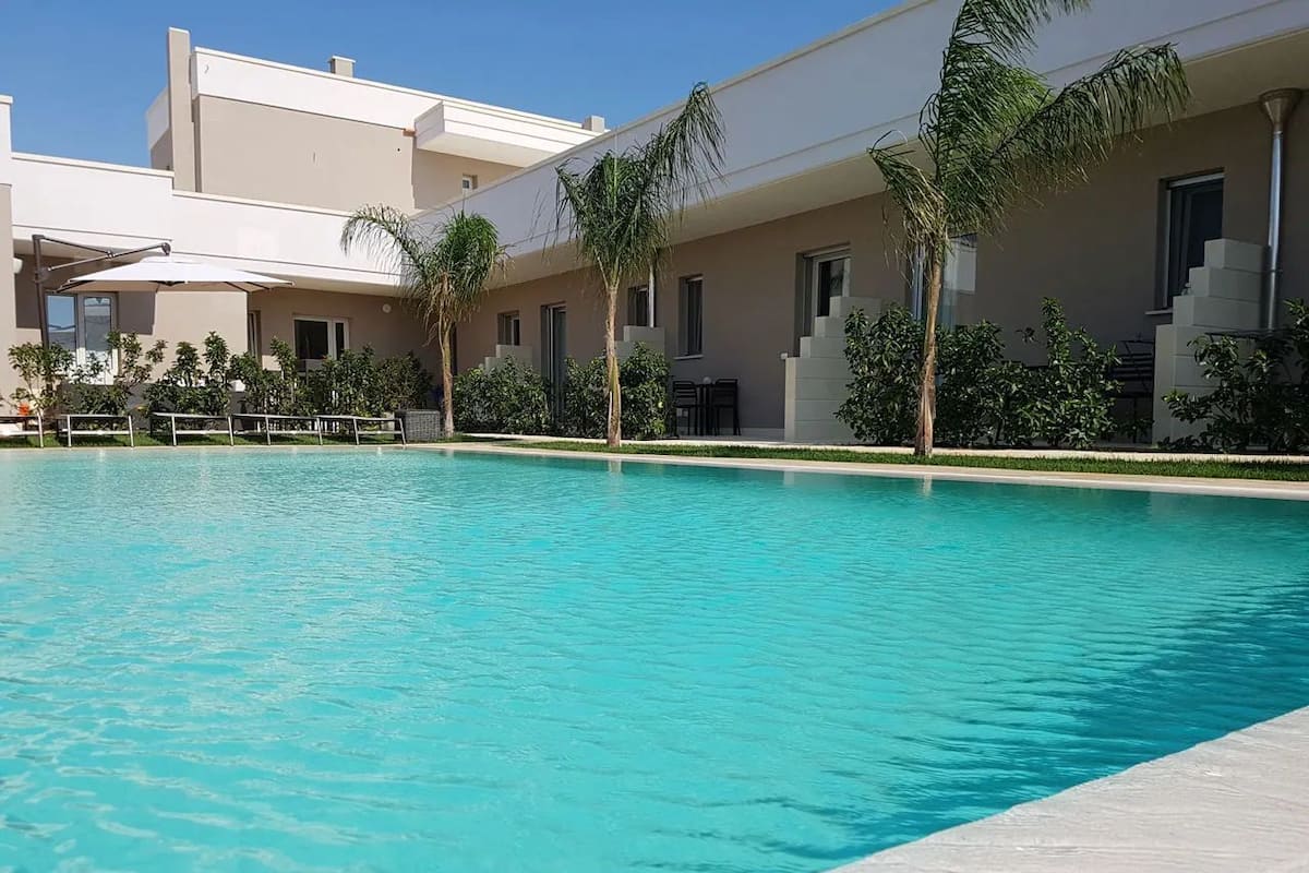 Deluxe Room, 1 Bedroom, Non Smoking, Pool View | Minibar, in-room safe, desk, soundproofing