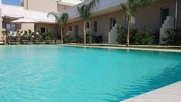 Deluxe Room, 1 Bedroom, Non Smoking, Pool View | Outdoor pool | Outdoor pool, sun loungers