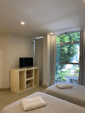 Studio, Kitchenette | Living area | 32-inch flat-screen TV with cable channels, LCD TV - Tacha Apartments (Buenos Aires)