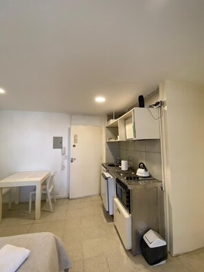 Studio, Kitchenette | Living area | 32-inch flat-screen TV with cable channels, LCD TV - Tacha Apartments (Buenos Aires)