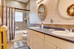 Combined shower/tub, jetted tub, designer toiletries, hair dryer
