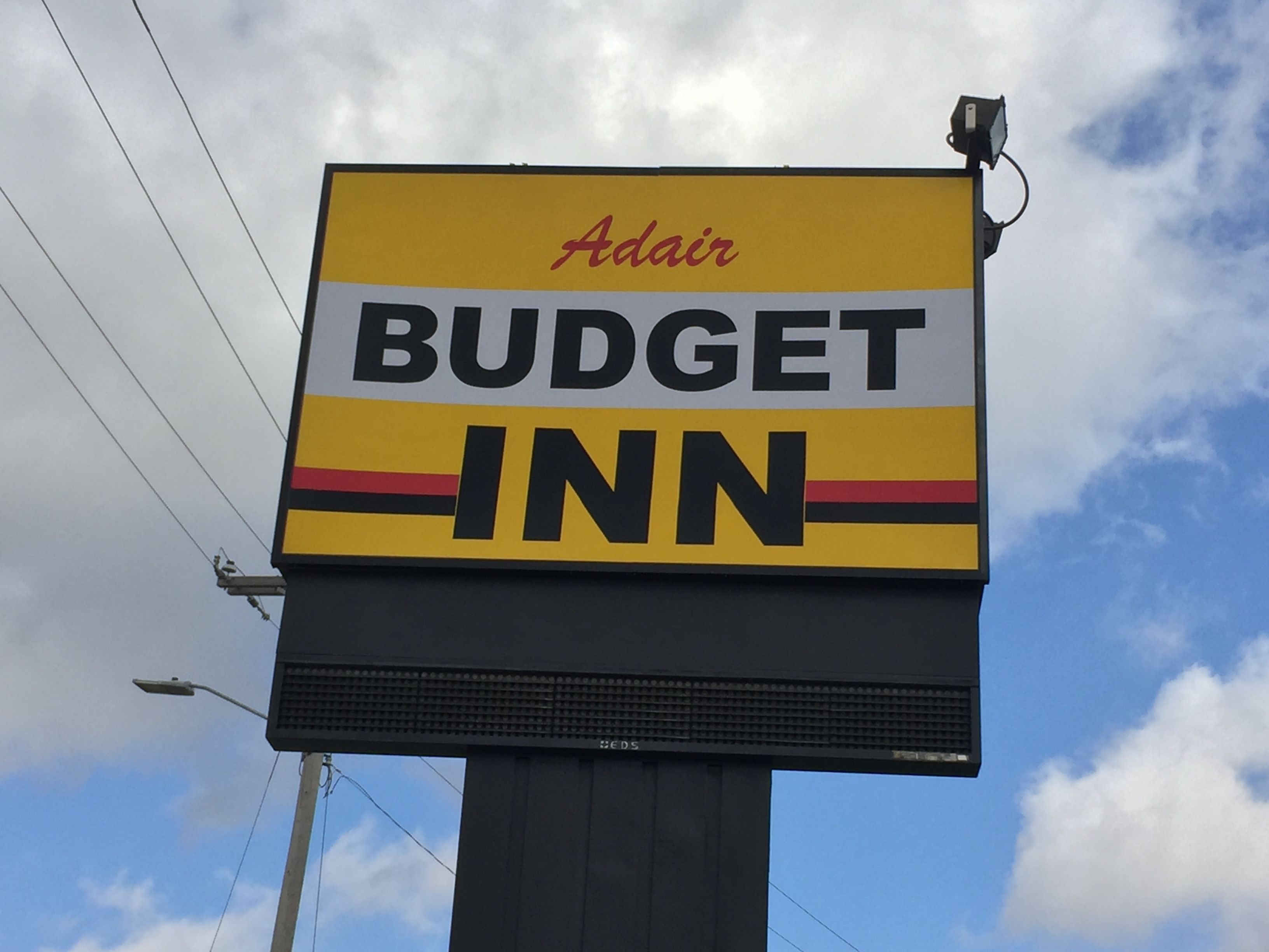 A billboard for Adair Budget Inn.