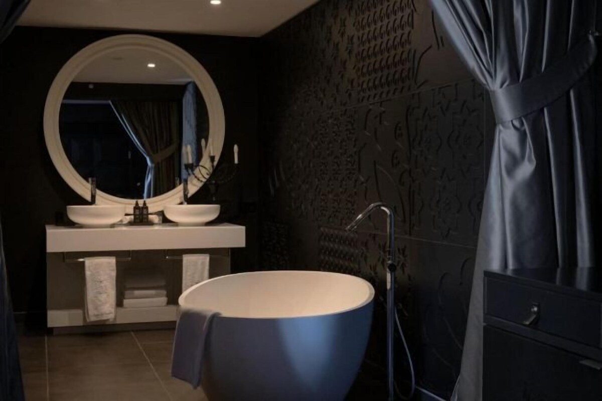 Bathroom | Rainfall showerhead, free toiletries, hair dryer, bathrobes