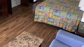 Standard Room, 1 King Bed | Living area | 32-inch TV with cable channels