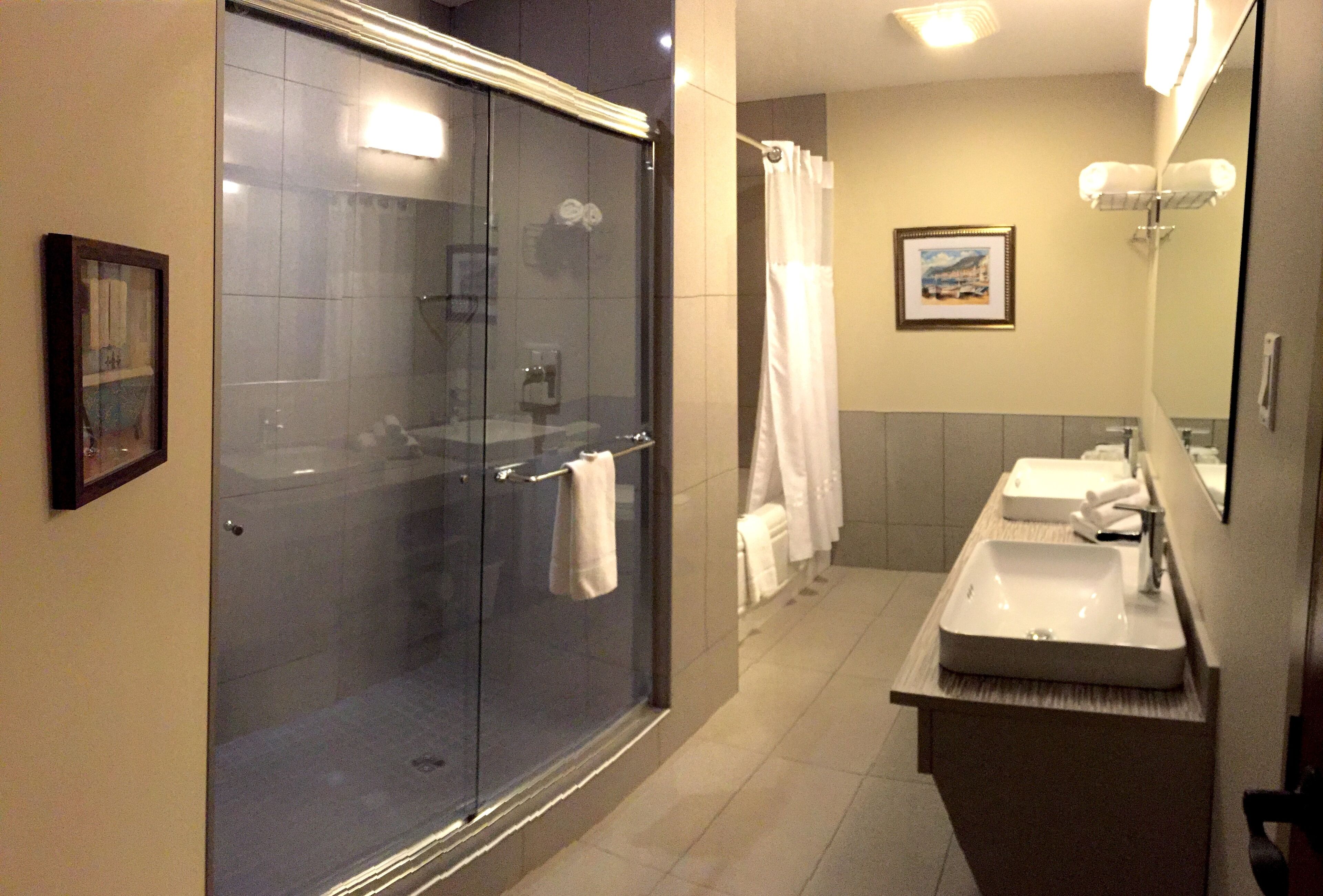 comfort room, 1 king bed with sofa bed, kitchenette | bathroom | designer toiletries, hair dryer, towels, soap