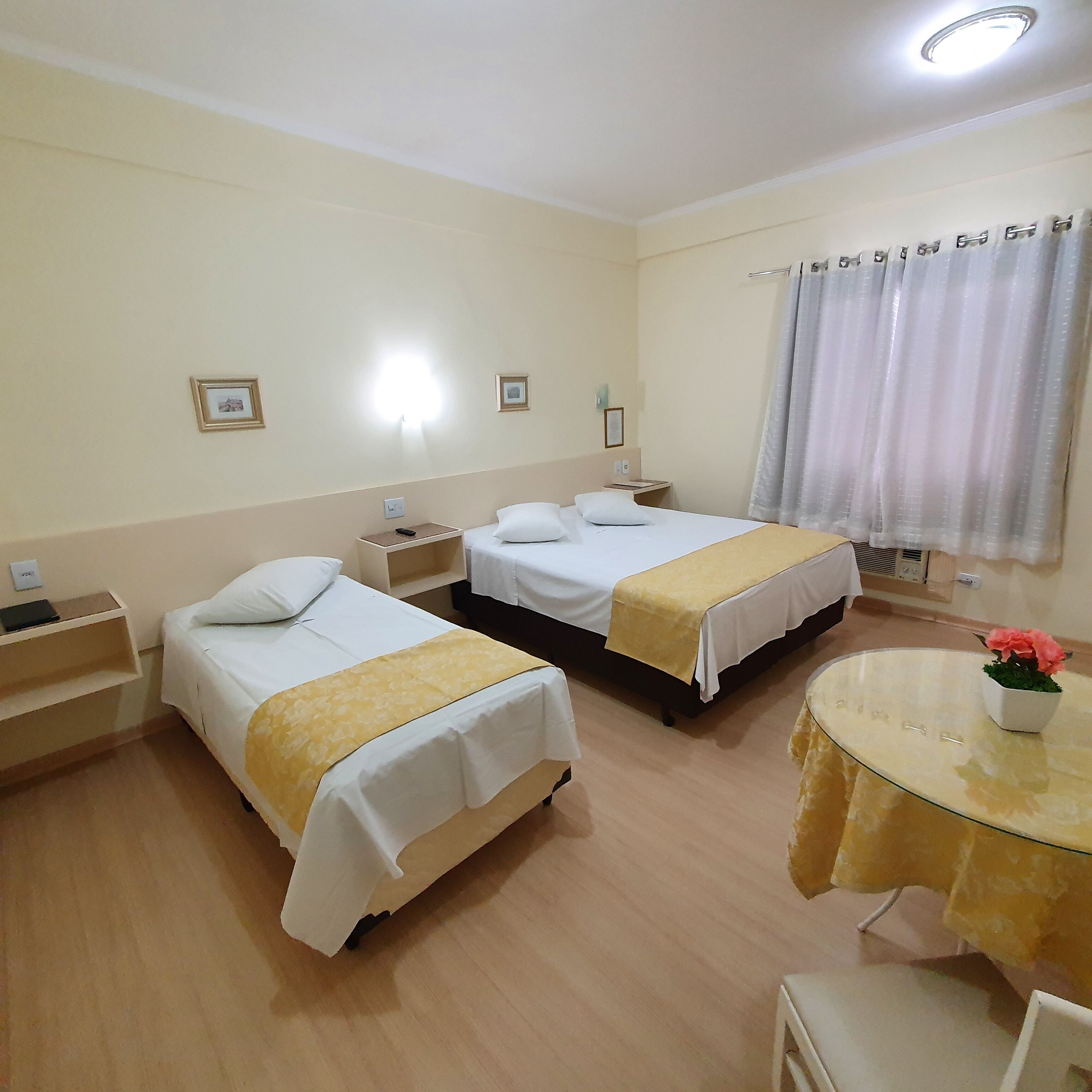 deluxe triple room | minibar, in-room safe, desk, blackout curtains