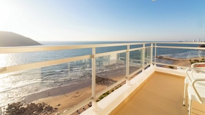A balcony with a clear view of the beach and ocean, featuring a white railing and a few chairs. - Pacific Palace Beach Tower Hotel (Mazatlán)