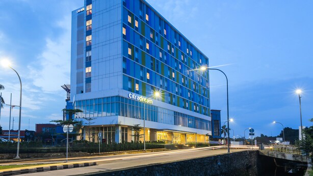 A modern hotel with a glass facade, multiple floors, and a prominent "Citadream" sign. - Hotel Citradream Bintaro (South Tangerang)