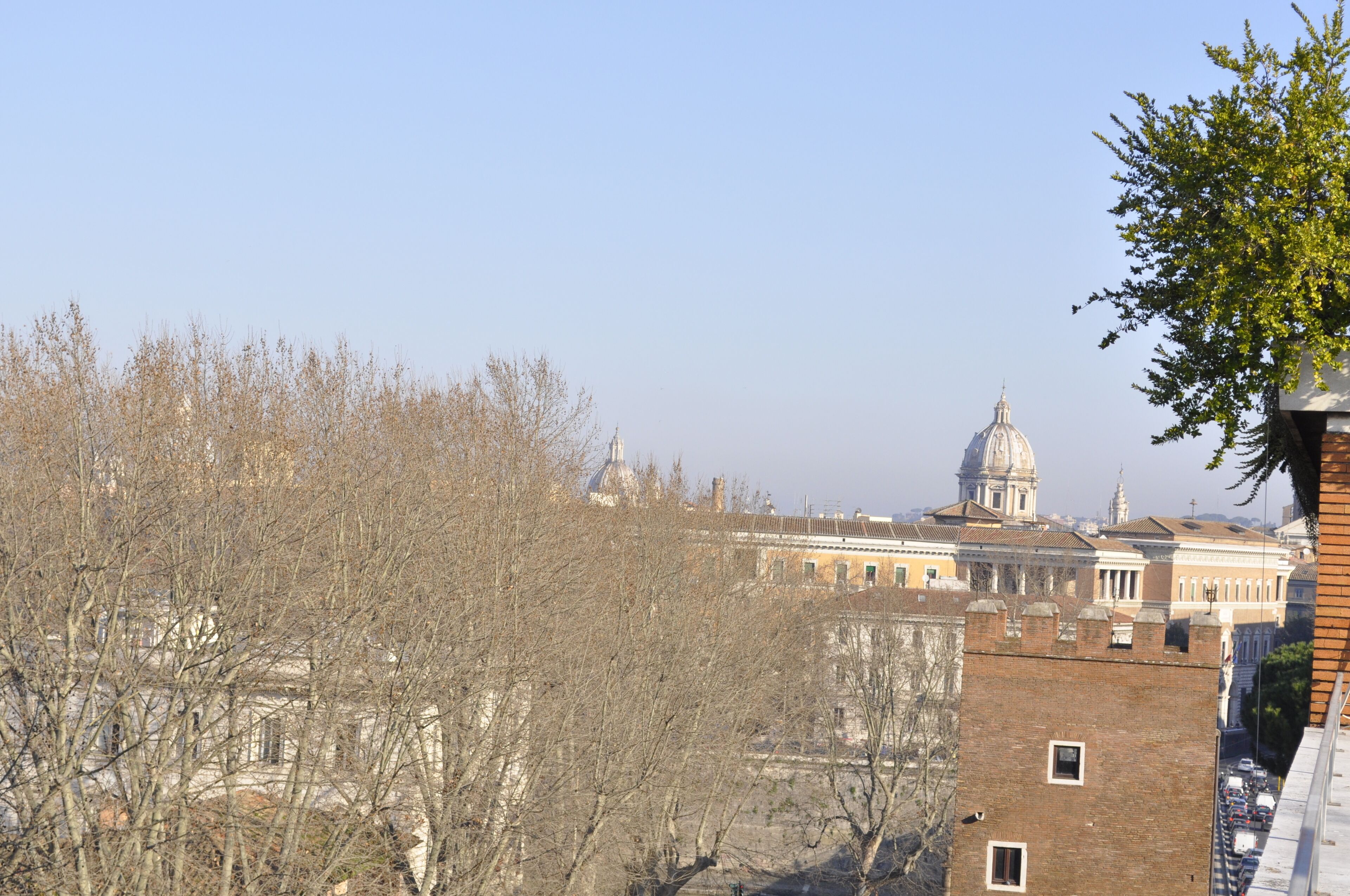 A view of a historic building with a prominent dome and classical architecture.