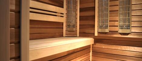 A sauna with wooden slats and a bench.