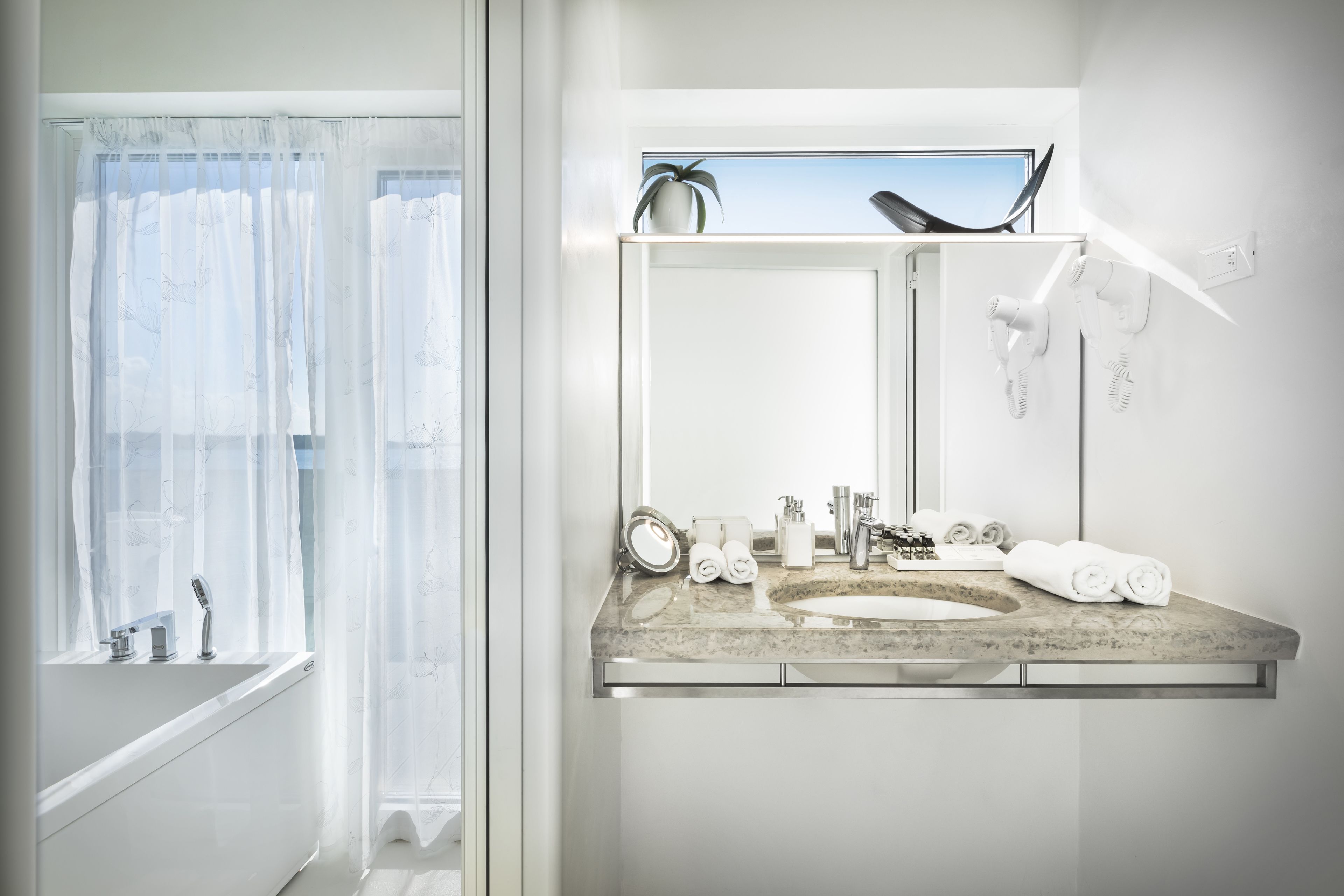 luxury suite, sauna, sea view | bathroom | combined shower/bathtub, free toiletries, hair dryer, bathrobes