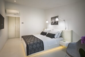 Roba de llit d'alta qualitat, minibar i caixa forta a l'habitació 