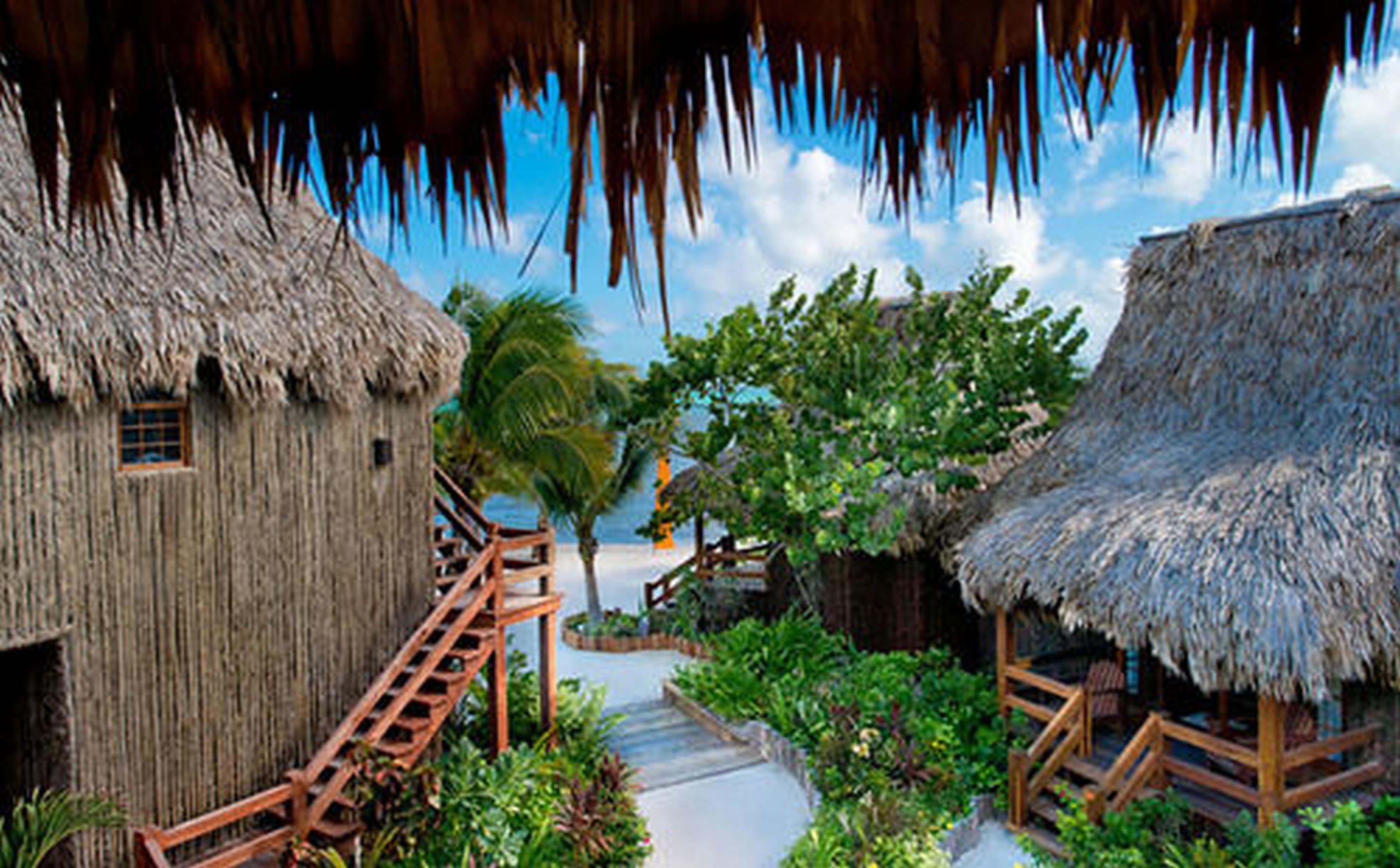 On the beach, white sand, sun loungers, beach towels