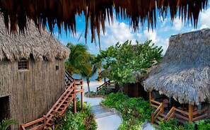 On the beach, white sand, sun-loungers, beach towels - Ramon's Village Resort (San Pedro)