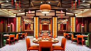 A restaurant with round tables, orange chairs, and a patterned floor. - Four Points by Sheraton Chengdu, Anren (Chengdu)
