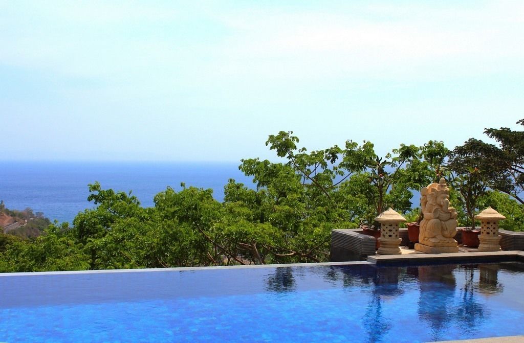 Outdoor pool, open 7:00 AM to 10:00 PM, pool umbrellas, sun loungers