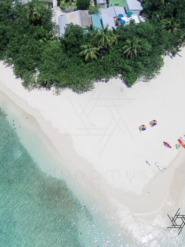 On the beach, white sand, beach towels, scuba diving