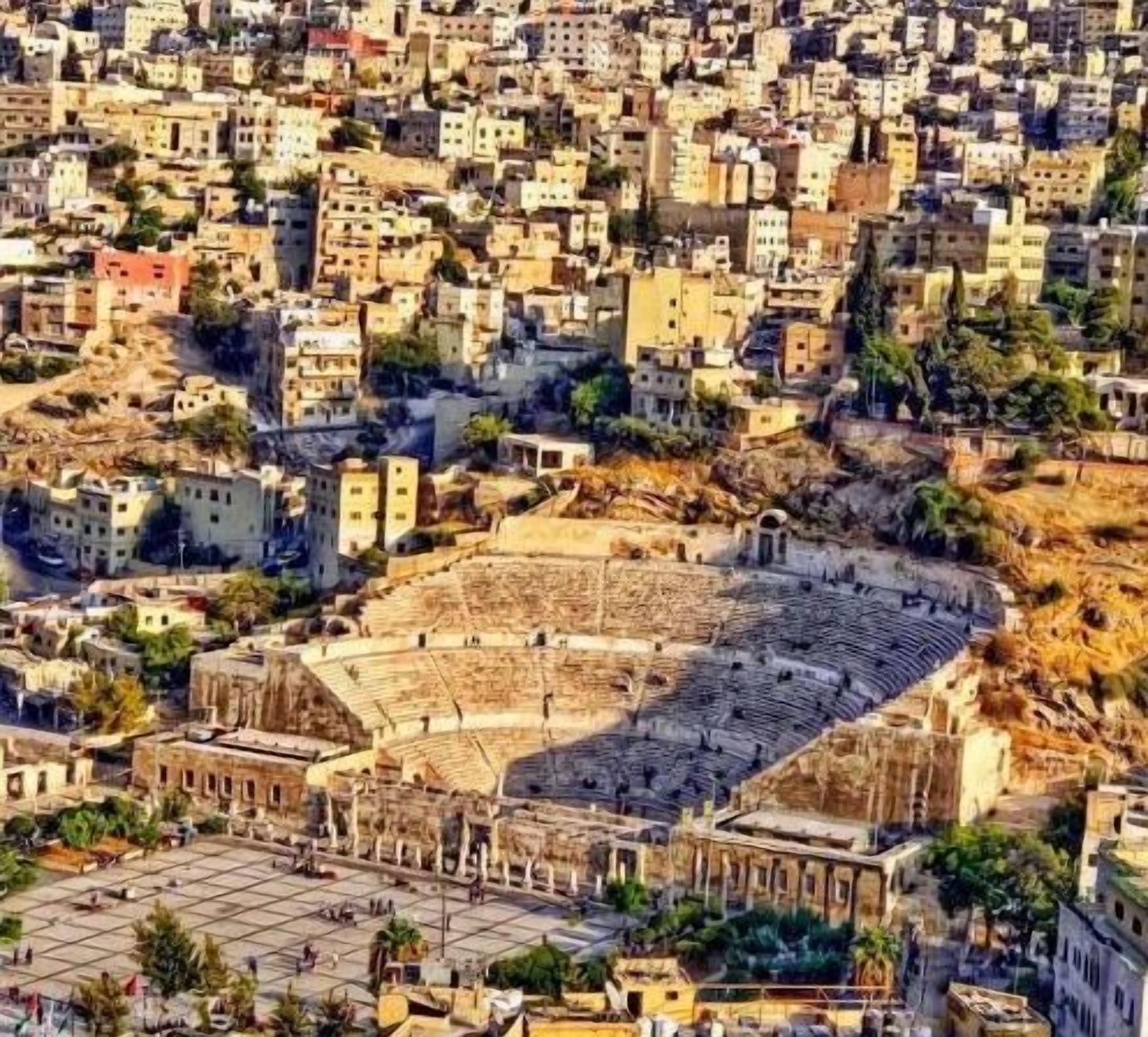 A densely packed urban area with a large, open-air amphitheater surrounded by closely built structures.