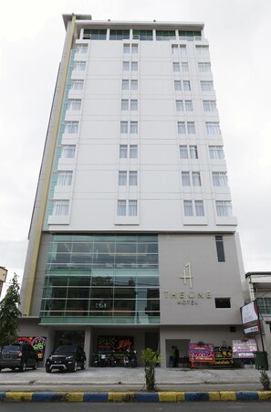 A modern hotel building with a prominent 'The One Hotel' sign on the facade. - The One Hotel Makassar (Makassar)