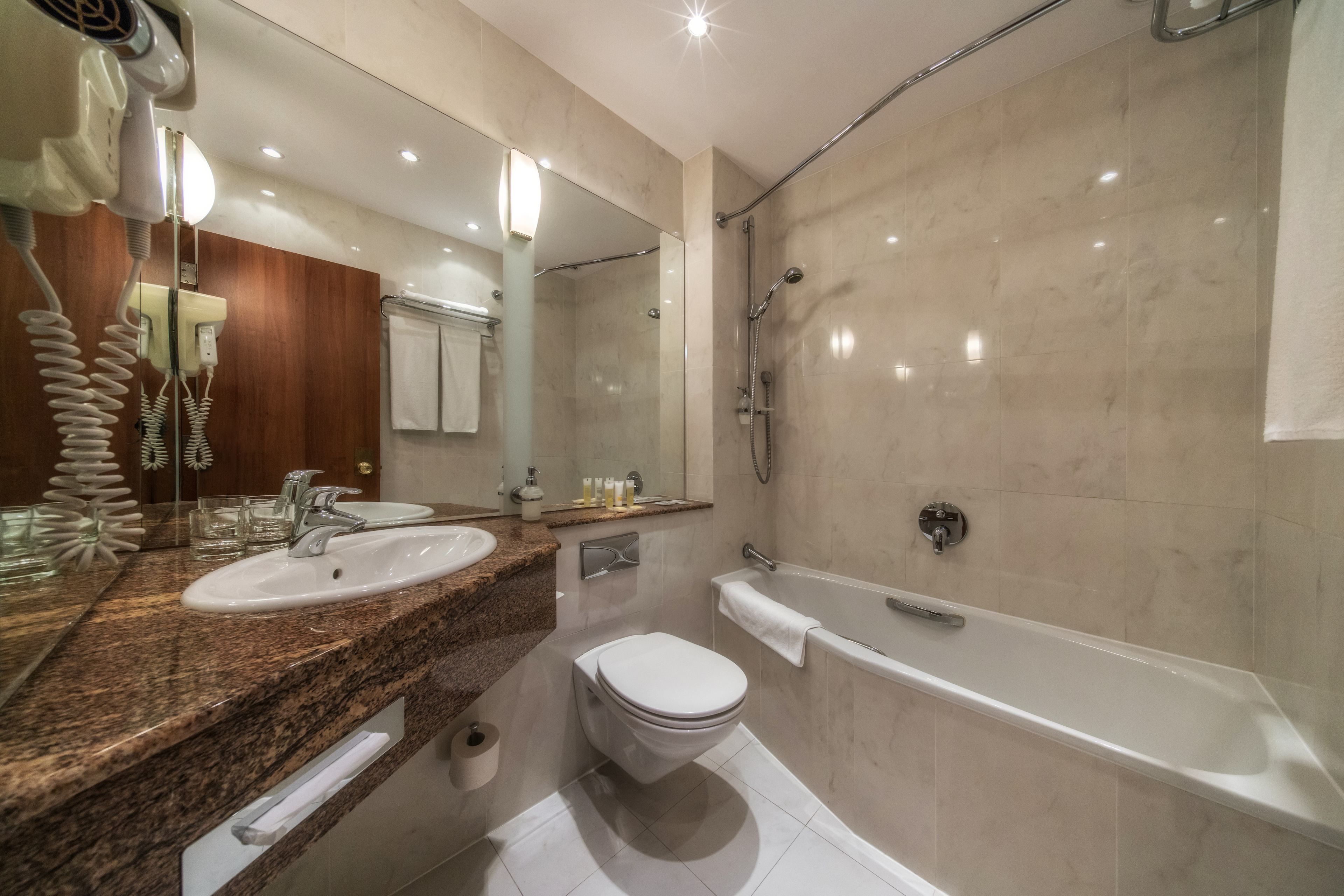 combined shower/bathtub, free toiletries, hair dryer, towels