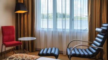 Superior Double Room, Lake View | Living area | 21-inch LCD TV with cable channels, TV