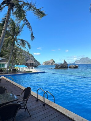 Private beach, white sand, sun loungers, beach umbrellas