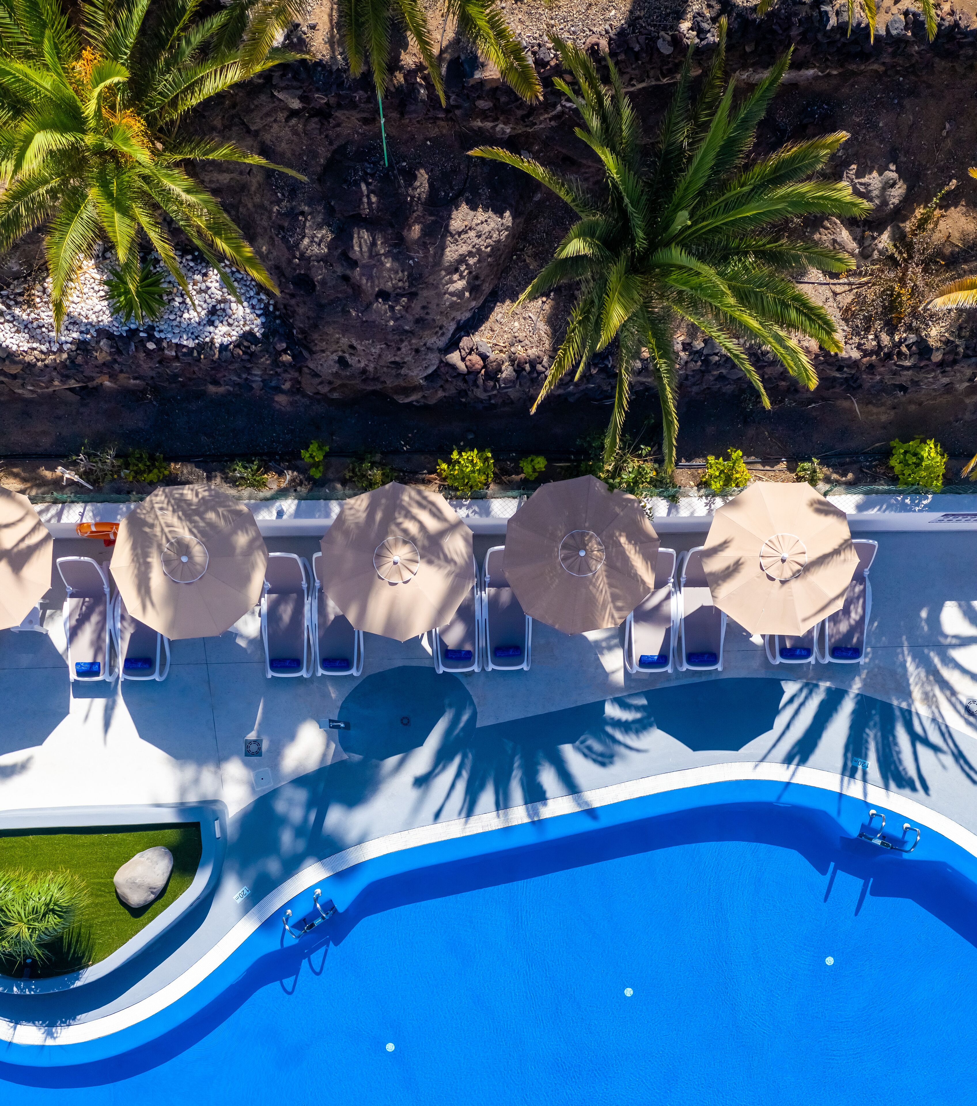 2 outdoor pools, open 9:00 am to 5:00 pm, pool umbrellas, pool loungers