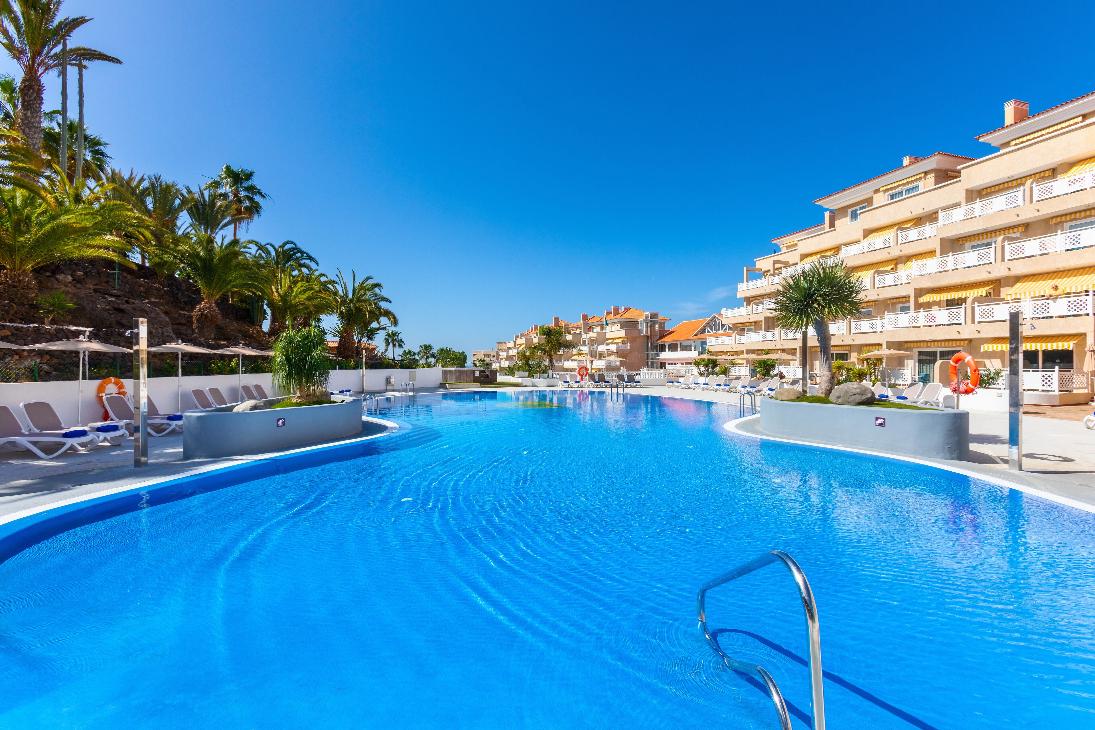 2 outdoor pools, open 9:00 am to 5:00 pm, pool umbrellas, pool loungers