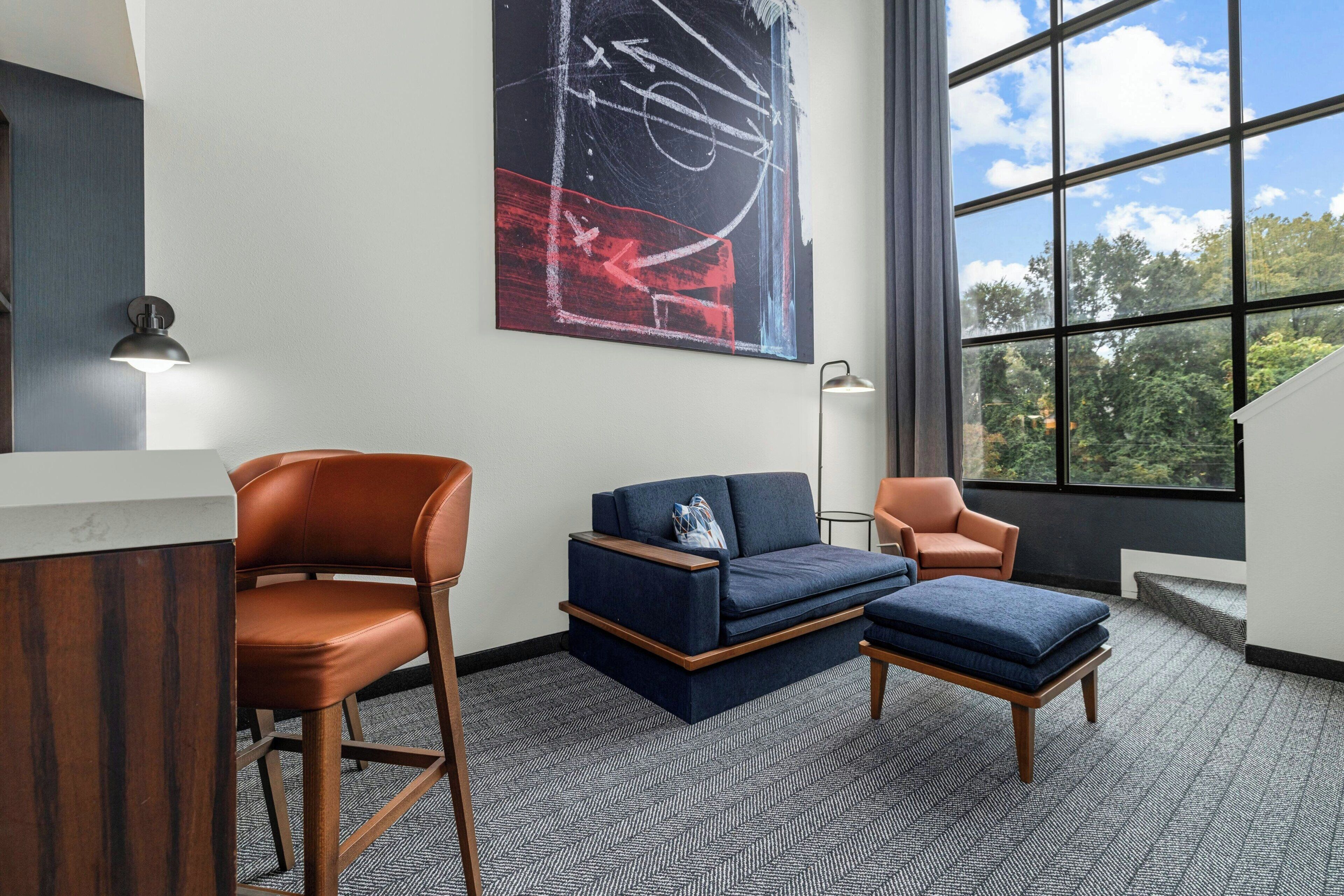 Hypo-allergenic bedding, desk, laptop workspace, blackout drapes