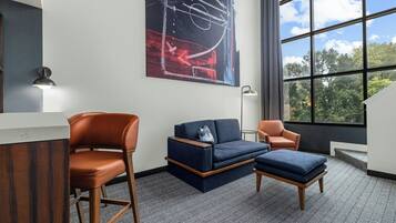 Hypo-allergenic bedding, desk, laptop workspace, blackout drapes