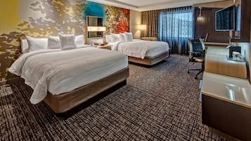 Hypo-allergenic bedding, desk, laptop workspace, blackout drapes