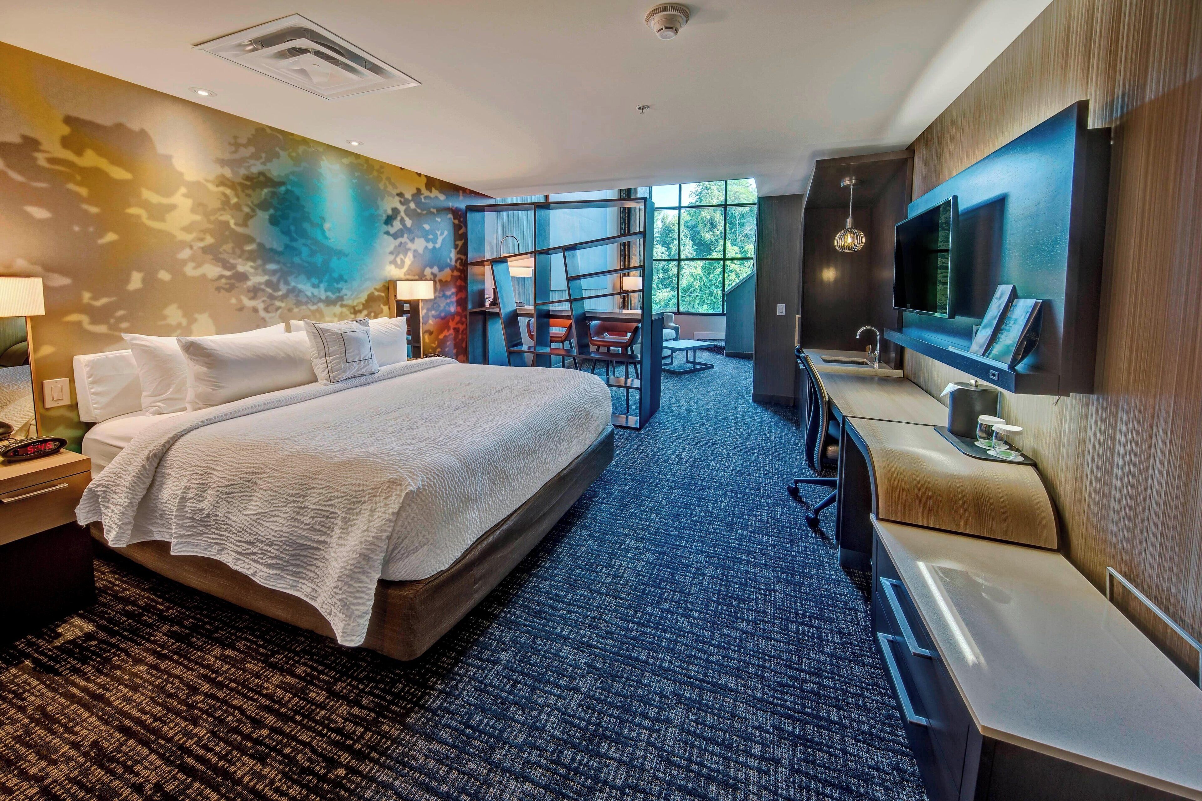 Hypo-allergenic bedding, desk, laptop workspace, blackout curtains