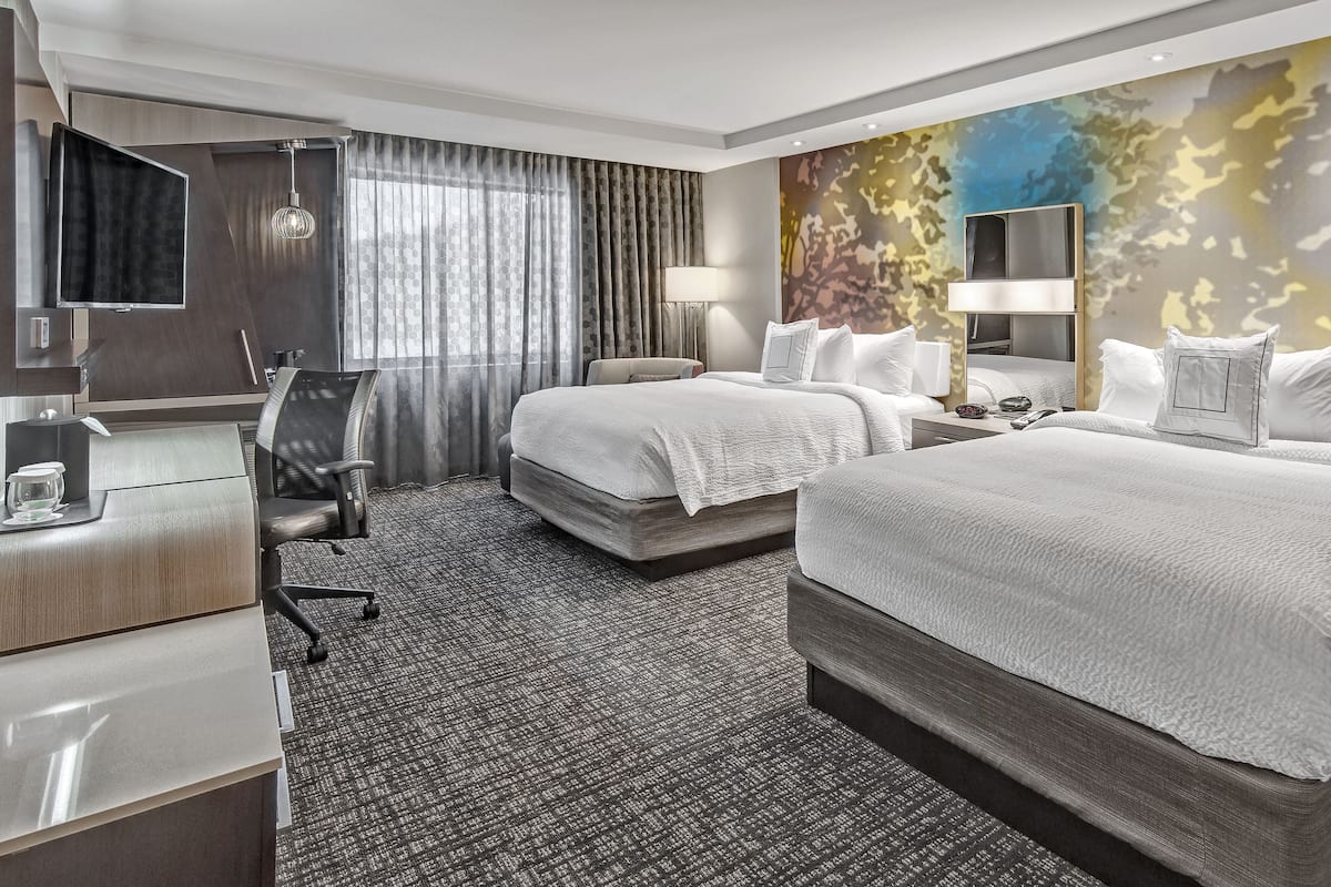 hypo-allergenic bedding, desk, laptop workspace, blackout curtains