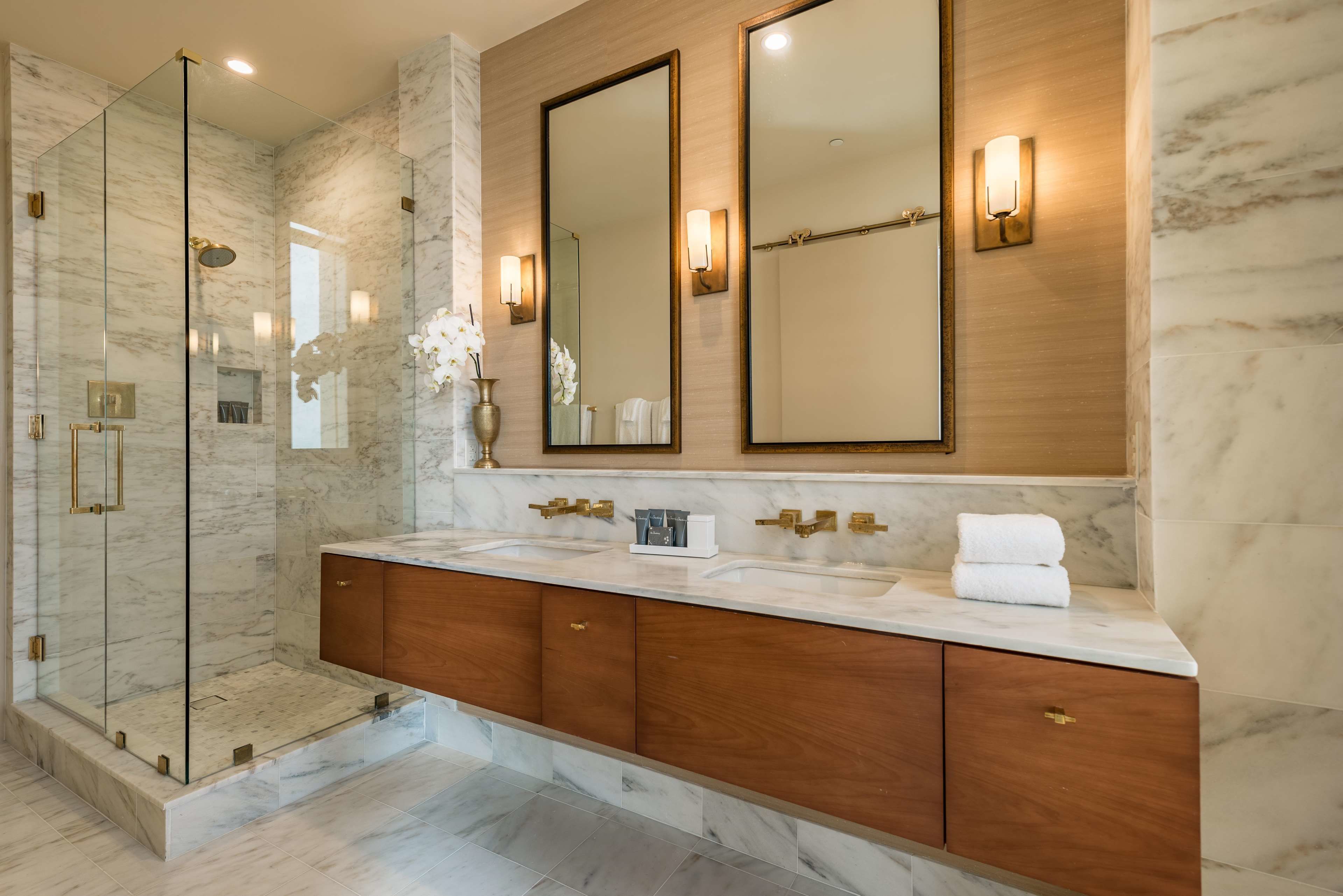 designer toiletries, hair dryer, bathrobes, slippers