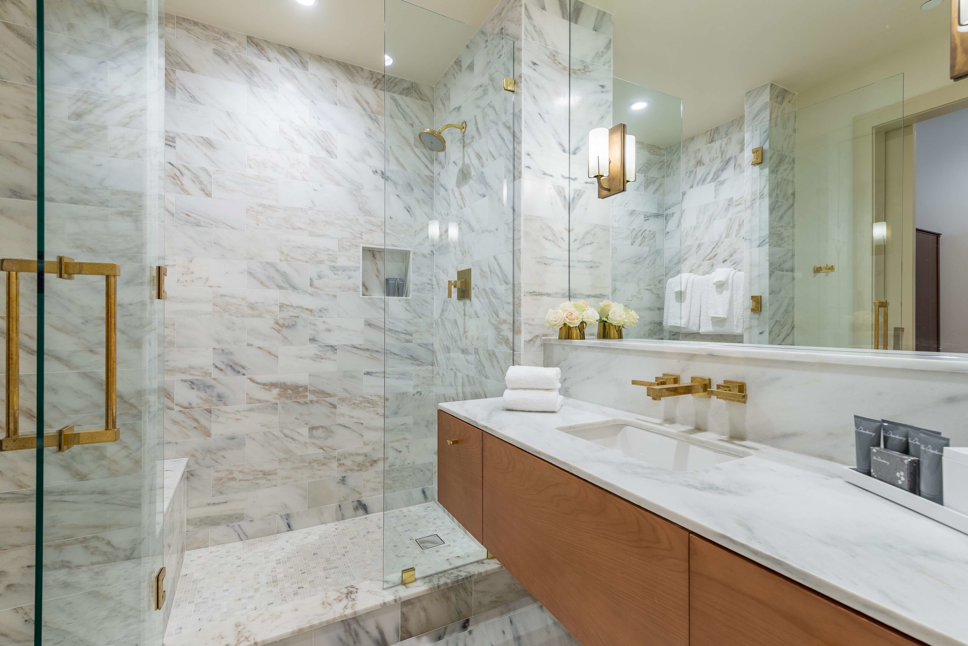 designer toiletries, hair dryer, bathrobes, slippers