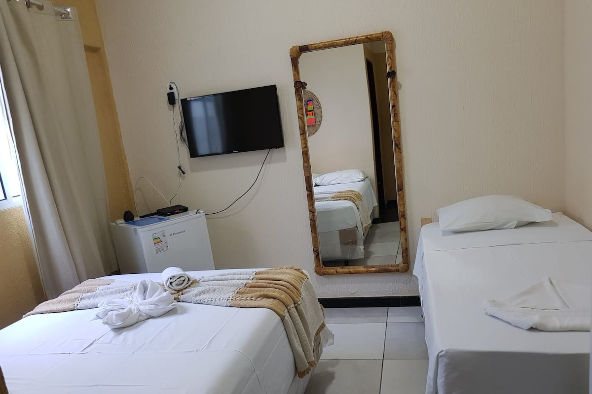 Deluxe Triple Room, 2 Bedrooms | Minibar, individually decorated, bed sheets